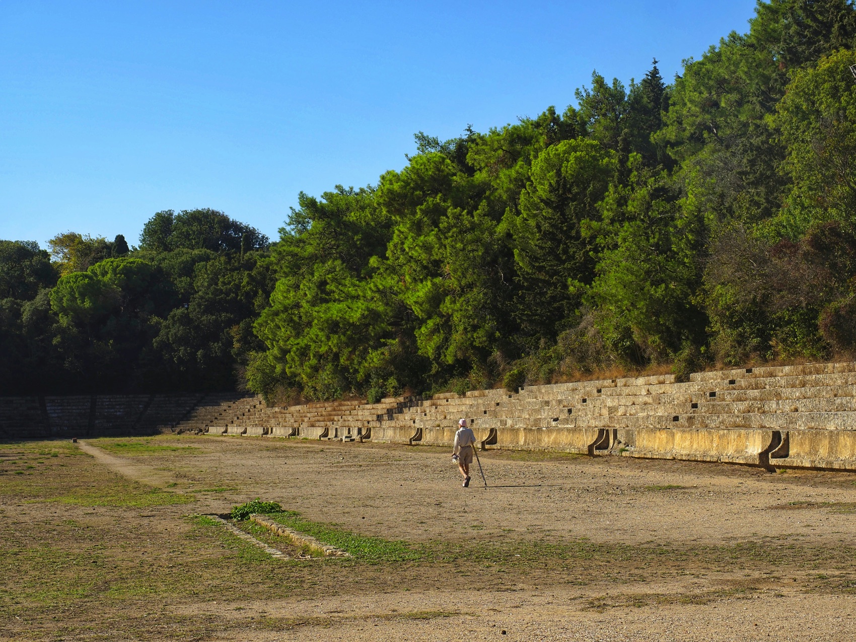 The ancient stadium below the Acropolis of Rhodes, surrounded by pines