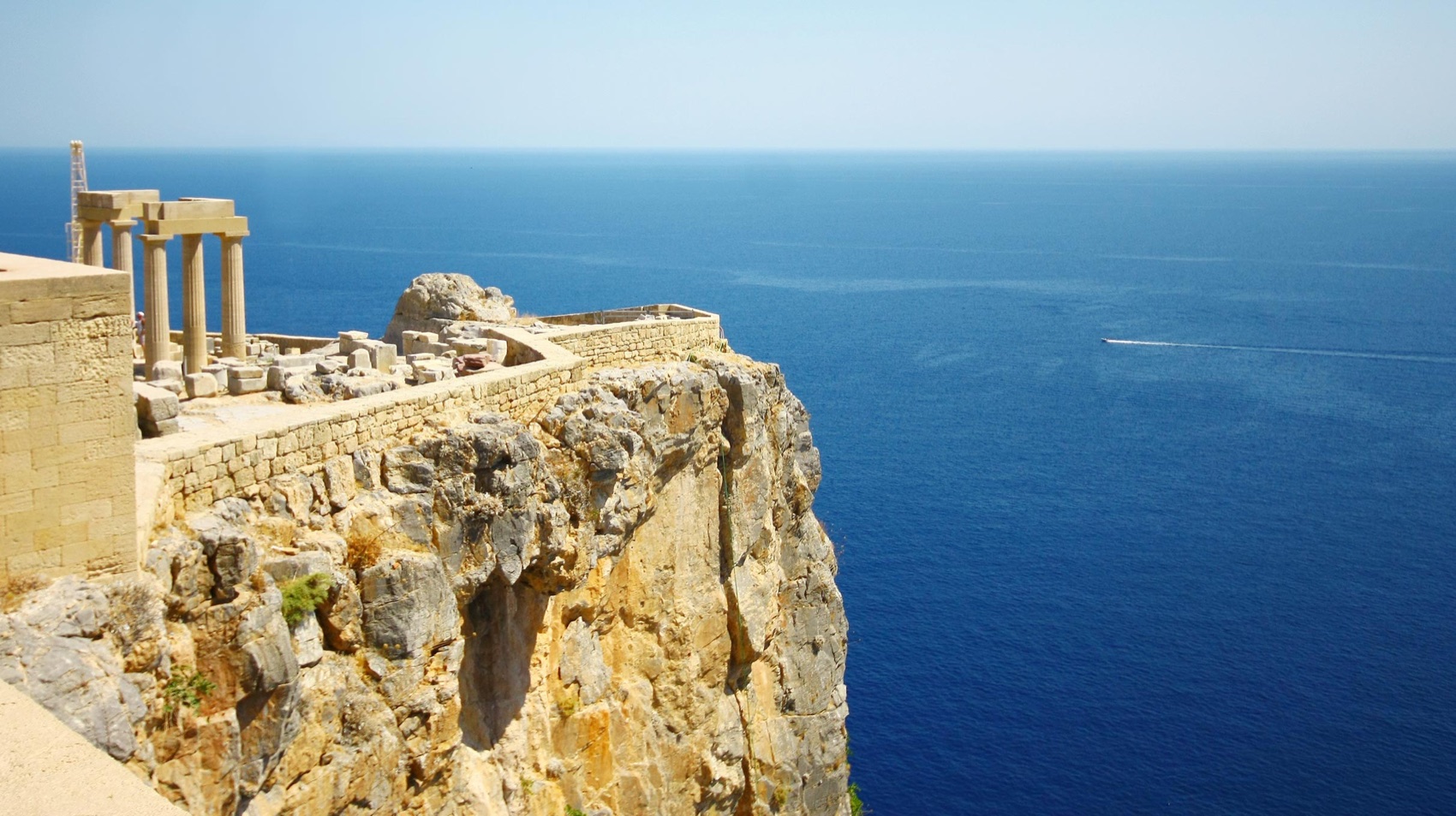 Fortress walls of the acropolis of Lindos high above the open sea