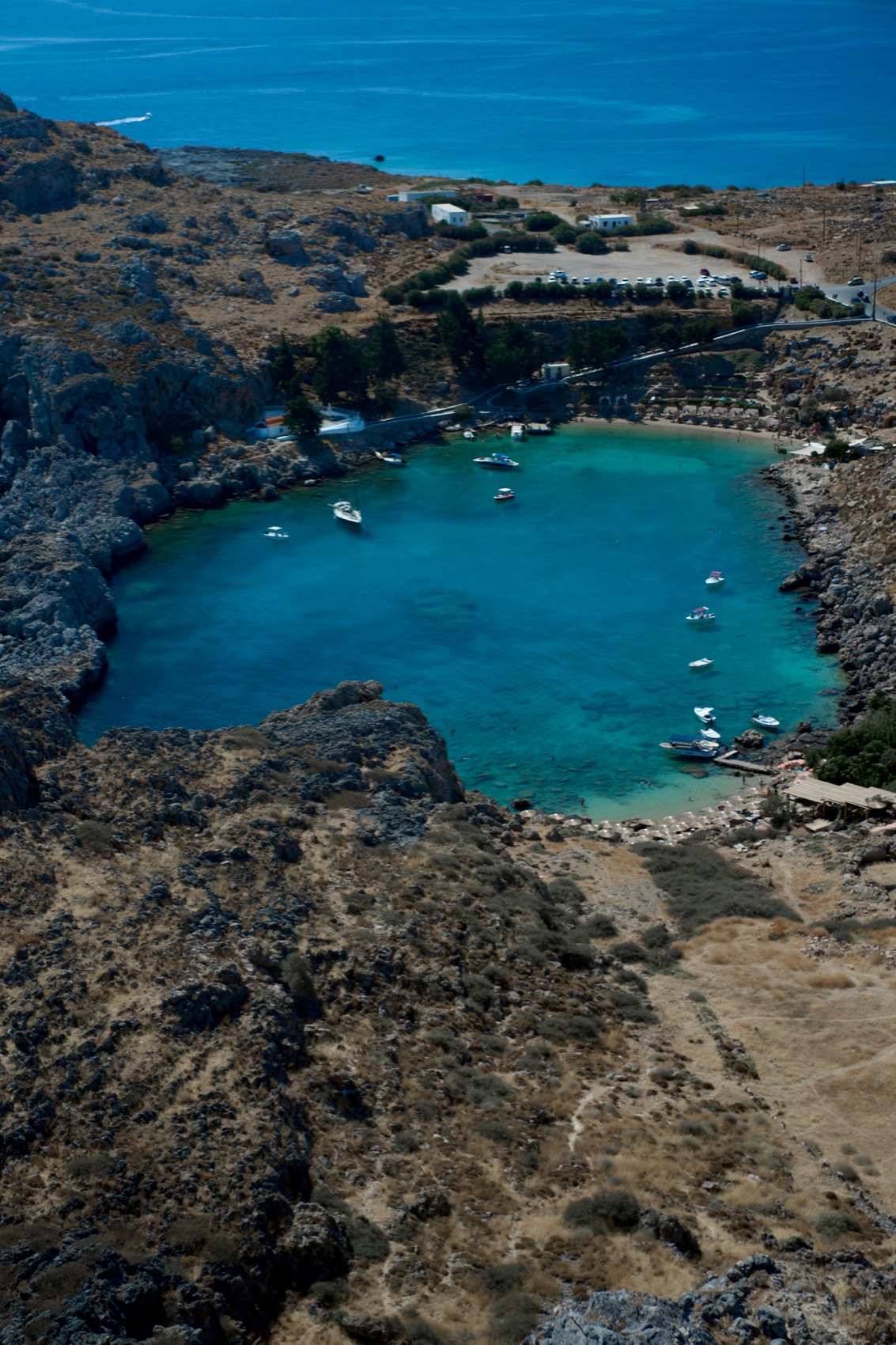 The enclosed rocky bay of Saint Paul below Lindos